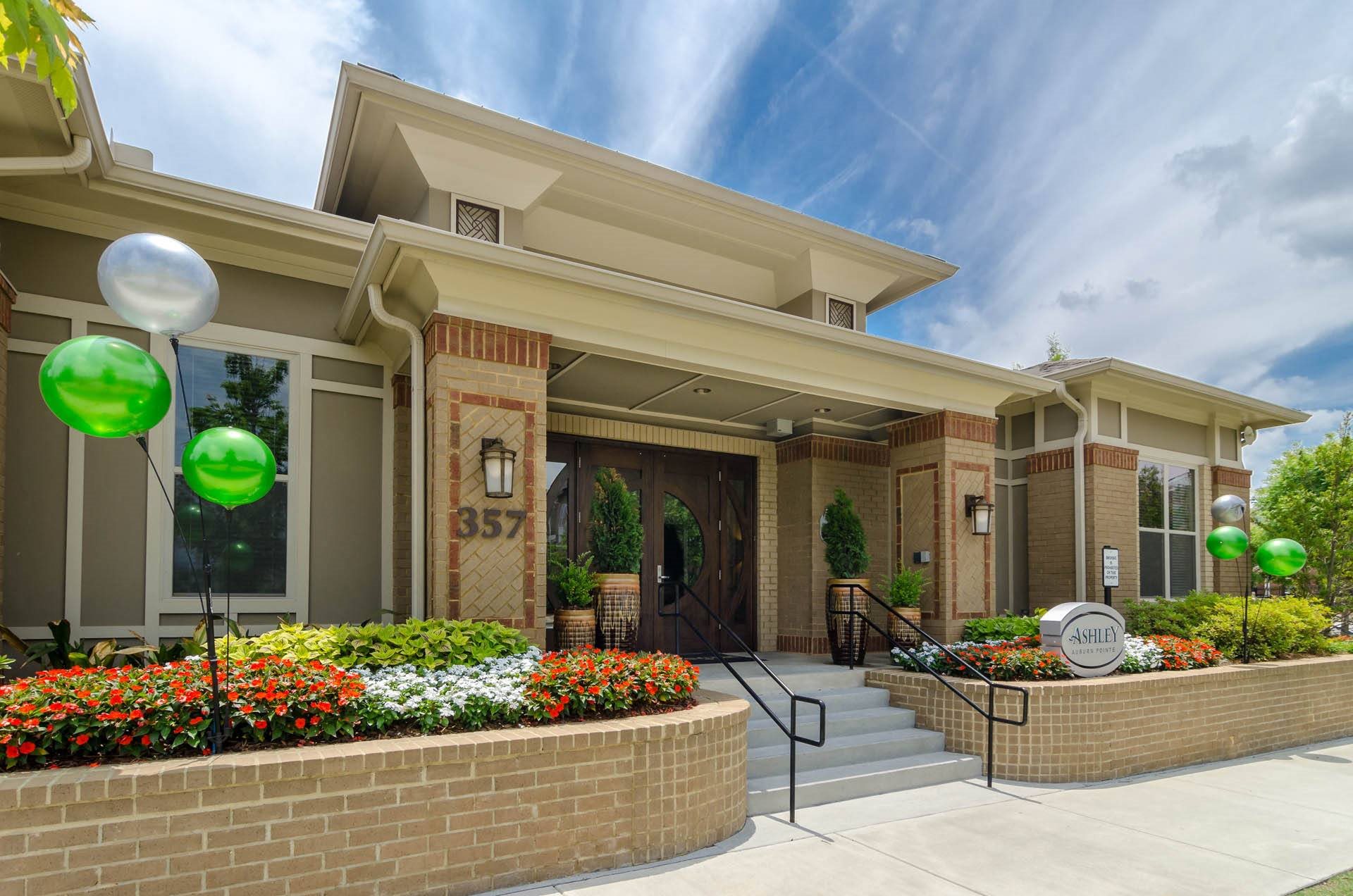 Leasing Office Exterior Office exterior featuring an arrangemnt of flowers at Ashley Auburn Pointe in Atlanta, Ga
